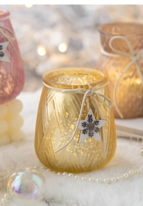 Close-up of golden and pink crackle glass candle holders with star charms and suede ties