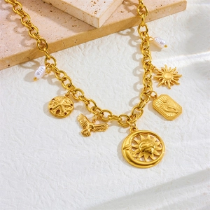 Vintage gold-plated stainless steel necklace with sun, moon, and pearl charms