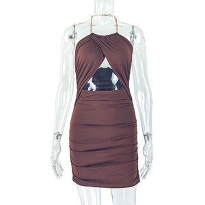 Detail of coffee brown dress featuring metal chain halter neck and ruched texture