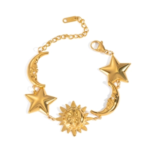 Gold celestial bracelet with sun moon and star charms on white background