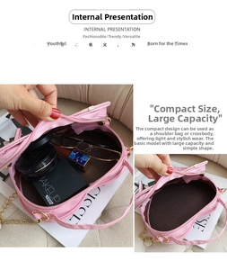 Internal view of pink heart-shaped crossbody bag showing storage for makeup and glasses