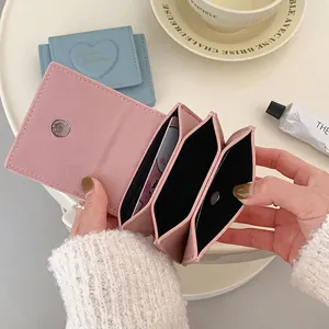 Pink heart embossed PU leather accordion wallet with three compartments and magnetic closure