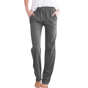 Close-up of dark grey cotton linen trousers showing drawstring waist and loose fit