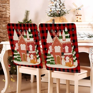 Detail of red and black buffalo plaid Christmas chair covers with snowman and deer motifs