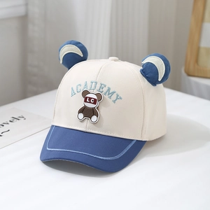 Close-up of color-block baby baseball cap with cute bear patch and 3D ears detail