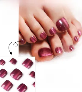 Detailed view of dark purple cat-eye press-on toenails with glossy glitter finish