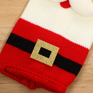 Knitted Santa Clause wine bottle cover with red festive pattern and golden belt buckle