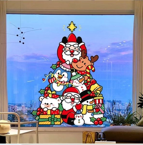 Christmas tree window sticker with Santa, reindeer and snowman on a glass window