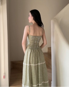 Detail of the back elastic ruching and lace hem on the green checkered dress