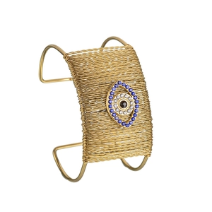 Detail of gold woven evil eye cuff bracelet with blue and white zirconia inlay
