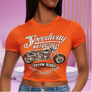 Close-up of orange cropped t-shirt featuring vintage motorcycle graphic and distressed hem