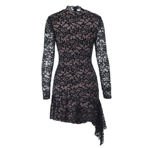 Detailed back view of black lace dress featuring long sleeves and asymmetric ruffled hem