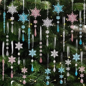 Clear acrylic snowflake and icicle Christmas tree ornaments set in pink and blue