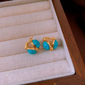 Vintage style round gold-plated hoop earrings with turquoise stone and hollow pattern