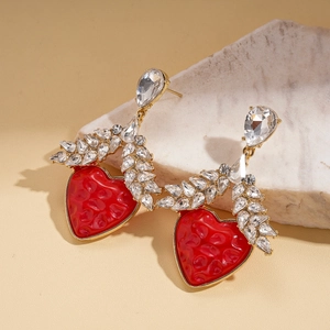 Elegant gold earrings with rhinestone leaves and red resin heart pendants for women