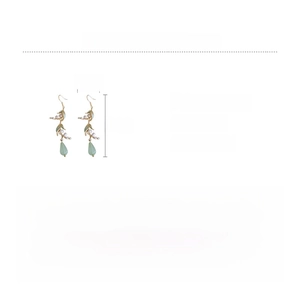 Detail view of vintage lily of the valley earrings with size and material specifications