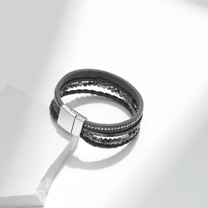 Bohemian multilayer braided leather bracelet with beads and metallic cross on white stone