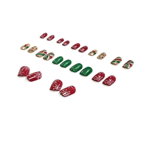 Christmas press-on nails set with red snowflakes and candy cane stripes patterns