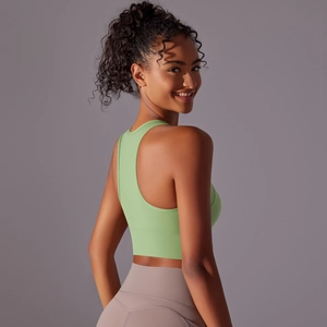 Rear view of light green racerback sports bra and mauve high-waisted yoga leggings