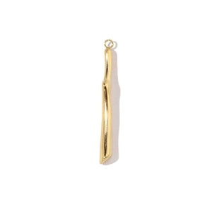 Macro shot of irregular gold pendant bar with polished finish and small top link ring