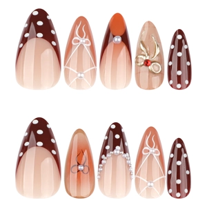 Faux ongles amande avec pois marrons, dégradé orange et nœuds 3D sophistiqués