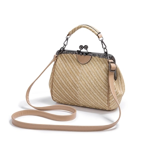 Retro beige woven straw handbag with PU leather handle and metal frame clasp closure
