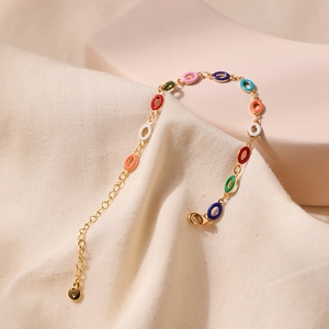 Vintage gold bracelet with multi-color enamel oval charms and adjustable lobster clasp