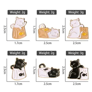 Set of six cute black and white cartoon cat enamel pins in various playful poses