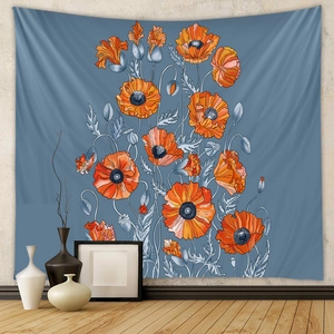 Detailed view of orange poppy floral tapestry hanging on a textured home wall background