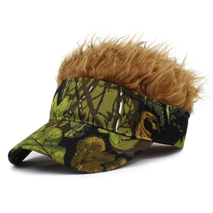 Detail of creative camouflage visor cap with synthetic golden brown hair wig on top