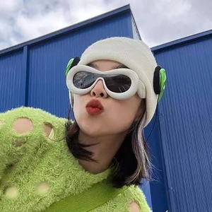 Y2K style white chunky knit beanie with matching white thick-frame fashion sunglasses