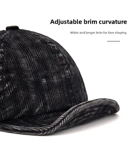 Macro shot of retro corduroy baseball cap with wide foldable brim and vintage texture