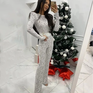Full-body view of a white lace patchwork long sleeve bodysuit for a trendy fall fashion look
