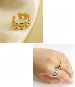 Close-up of skull open ring in gold and silver finish with vacuum plating details