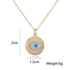 Detail of evil eye pendant with dimensions 2cm x 1.5cm and 6g weight on white background