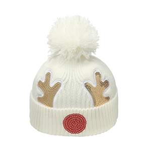 Children's white Christmas knitted hat with gold sequined reindeer antlers and pom-pom