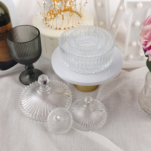 European fluted glass storage jars and tall smokey grey goblet on a festive table