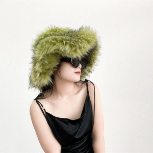 Detail of fluffy grass green faux fur hat with thick punk style texture for winter