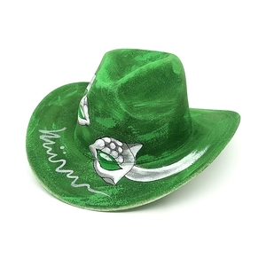Detailed view of green cowboy hat with silver hand-painted mask motifs and artistic textures