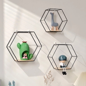 Set of 3 hexagonal wall shelves with black metal frames and natural wooden bases
