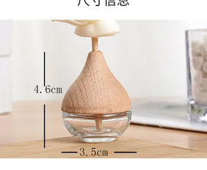 Macro detail of clear glass diffuser bottle with wood cap and handmade sola flower