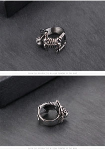 Macro detail of gothic skull ring showing vintage texture and ribbed steel band