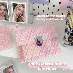 Detailed view of pink heart-shaped bubble wrap packaging for protecting small cards
