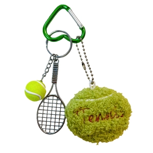 Plush tennis ball keychain with metal racket and green heart-shaped carabiner