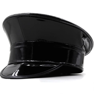 Detail of black glossy patent leather flat top cap with high shine finish and stitching
