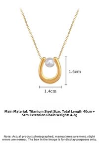 Detail view of U-shaped gold titanium steel pendant with central pearl and dimensions