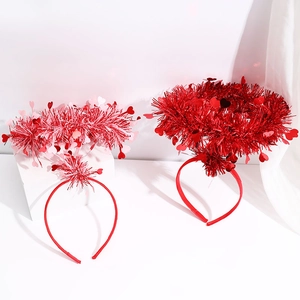Detail of glitter pink and red heart headbands for Valentine's Day party favors