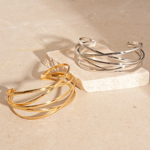 Minimalist geometric multilayer crossed open bangle in gold and silver mirror finish