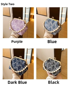 Detail of four denim evening bags with pearl handles and quilted texture in various colors
