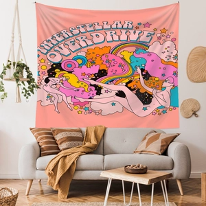 Detail of retro psychedelic tapestry with Interstellar Overdrive text on white wall